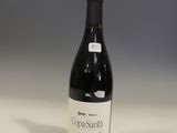 a bottle of wine that is sitting on a table