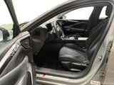 the interior of a car with the door open and the driver ' s seat up