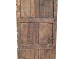 an old wooden door with six drawers on top of it