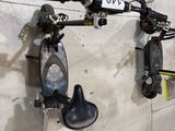 two bikes hanging on the wall next to each other