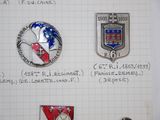 some pins are sitting on a piece of paper on a piece of paper