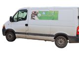 a white van that is parked on the side of the road