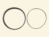 a close up of a couple of rings on a white surface