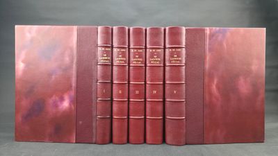 a set of three books sitting on top of each other on a table