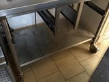 a stainless steel table with a laptop on it