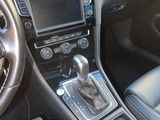 the interior of a car with a steering wheel and dashboard controls