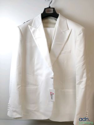 an image of a white suit hanging on a wall