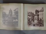 an open book with a picture of a statue on top of it