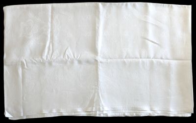 a piece of white paper that has been folded on a table