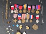 many medals and other items that are on the table