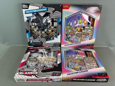 two boxes of pokemon trading cards are sitting on a table