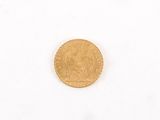 a gold coin with a picture of a man on it