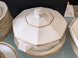 many plates and bowls sitting on a glass table