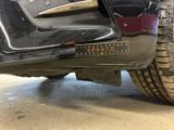 a close up of a car ' s bumper with a sticker on it