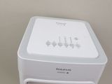 a small white air conditioner sitting on a table