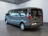 a silver van that is parked in a room