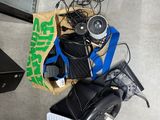 a pile of electronics on the floor next to a tv