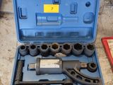 a blue tool case with tools in it on the floor