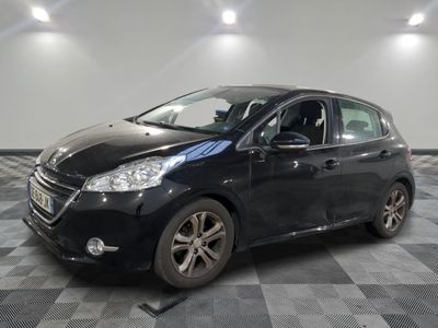 the black car is parked in the garage on the checkered floor