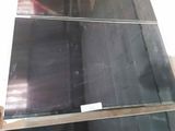 a lot of black glass on a shelf in a store