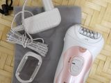 a pink and white electric shaver on a table