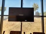 a flat screen tv mounted on the wall in a room