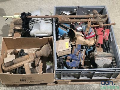 two boxes full of assorted items sitting on the ground