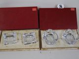 two glass ashtrays in a red box on a white surface