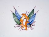 a picture of a plate with a bird and flowers on it
