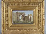 une image représentant un tableau représentant un bâtiment, dans un cadre doré accroché au mur