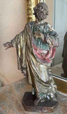 a statue of a man holding a baby in his arms