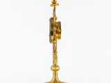 an image of a clock on a stand with a pendulum