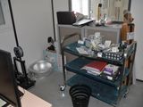 an image of a living room with a television and a desk