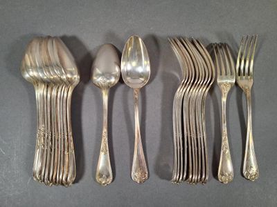 five silver spoons and two silver spoons on a table