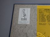 a yellow piece of paper with a picture of a plane on it