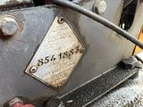 a close up of a motorcycle with a number plate on it