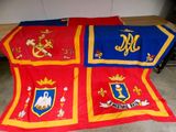 a red and blue blanket with a coat of arms on it