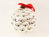 a glass ornament with a red bow on it