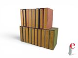 several books stacked on top of each other on a white surface