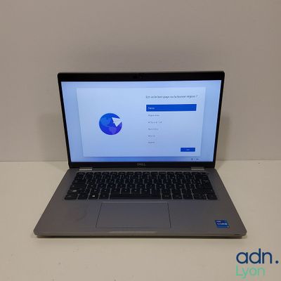 an open laptop computer sitting on top of a white table