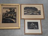 three framed pictures of trees and a mountain are on the floor