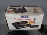 a box with a game on it and a game controller in front of it
