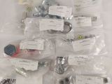 a lot of screws and nuts on the table