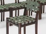 six chairs that are lined up in a row