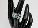 an image of a hand with a ring on it ' s finger