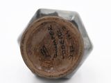 an image of a close up of a metal object with writing on it