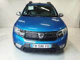 a picture of a blue dacia parked in a garage