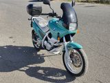 a motorcycle that is parked on the side of the road