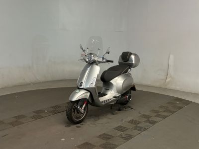 a scooter that is parked inside of a building