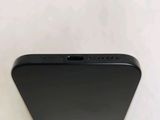 a close up of the back of a black iphone with a camera attached to it